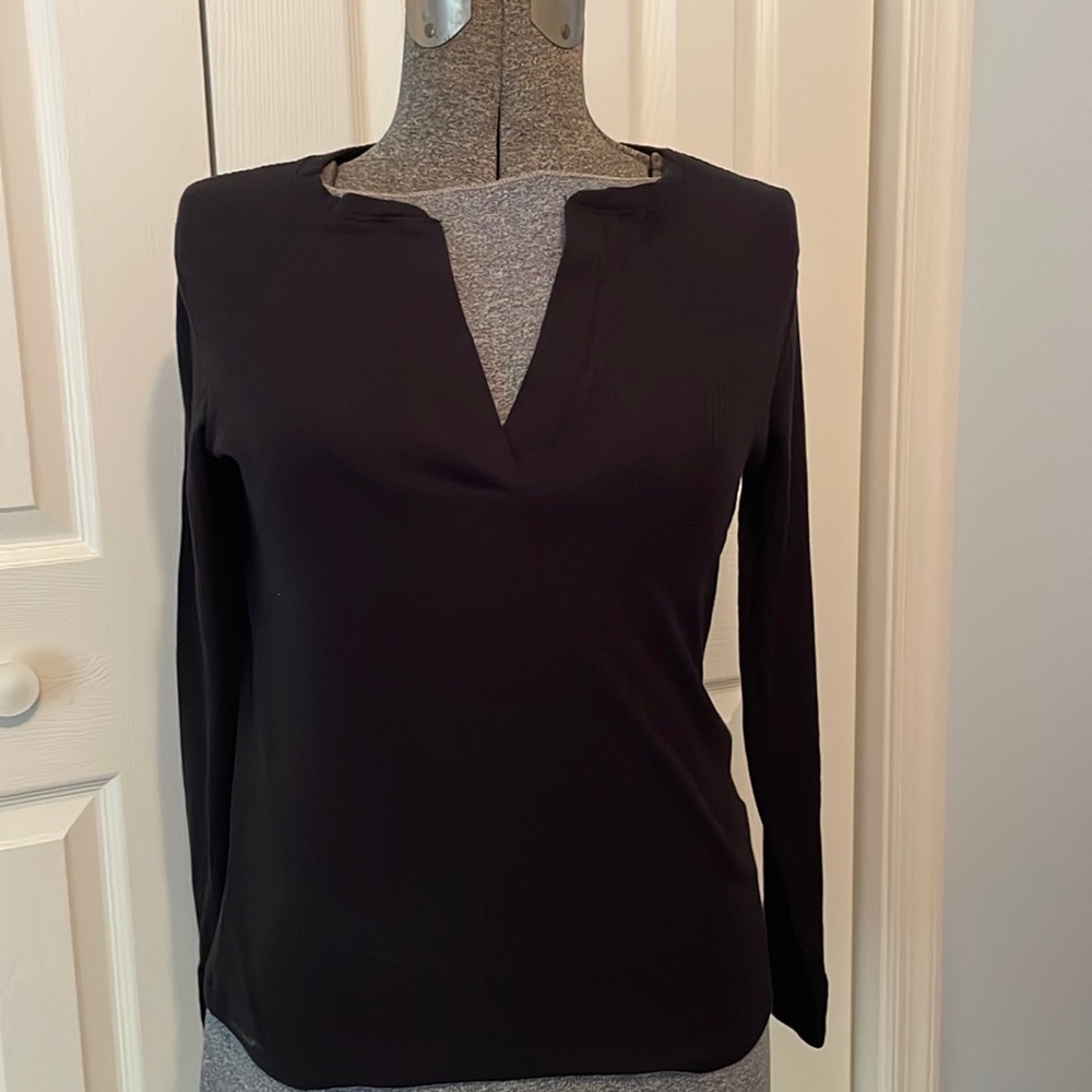 Black split neck and sleeve top.